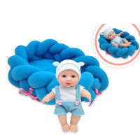 Imagen de Bebote, cuerpo de plástico y cara de goma, 18cm con cuna, en bolsa