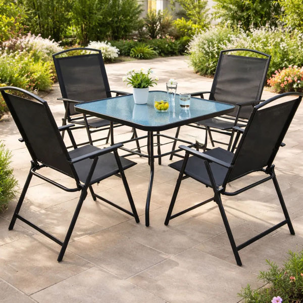 Imagen de Mesa de metal color negro tapa de vidrio, con 4 sillas de metal y textiline