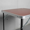 Imagen de Mesa de aluminio plegable, tapa símil madera color oscuro, con asa, en caja